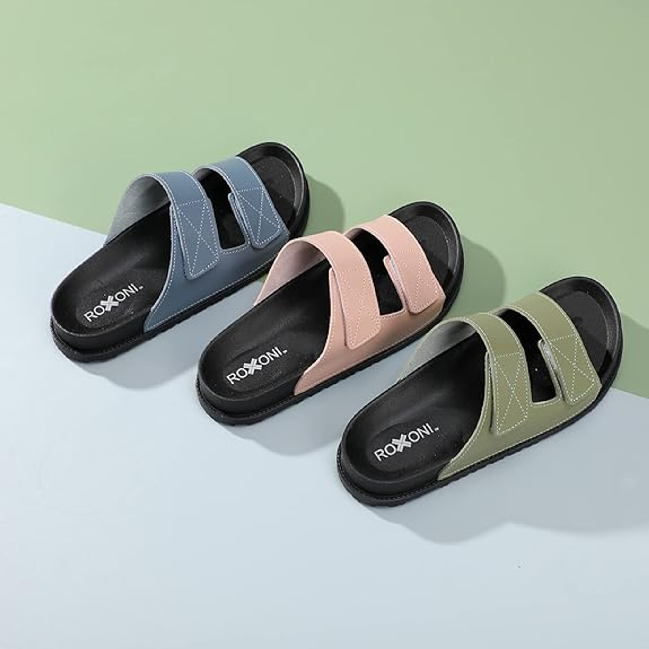 Women’s cushioned two-strap open-toe slide sandals shown in blue, blush pink, and olive green
