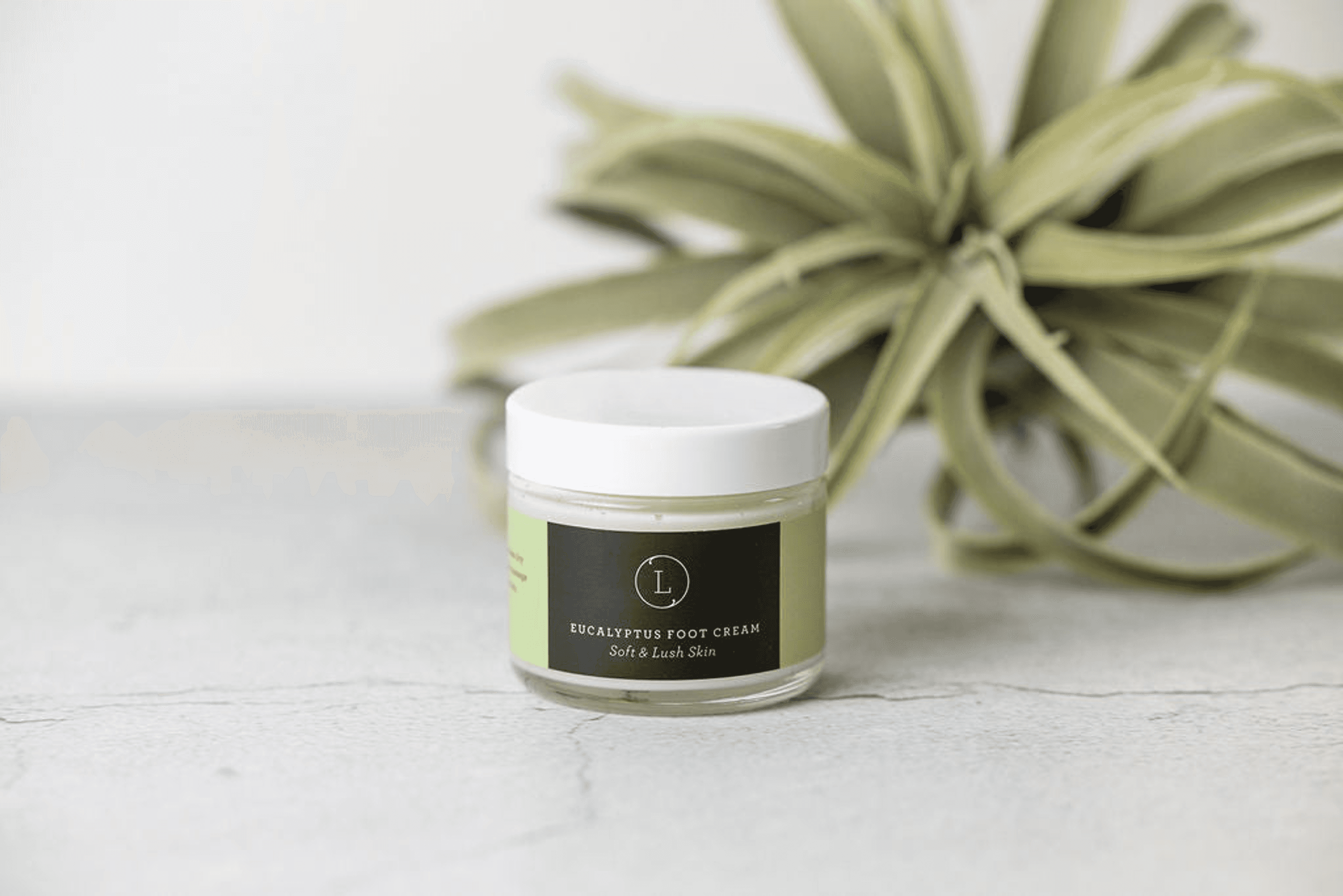 Eucalyptus foot cream jar with white lid and green label, round cream container