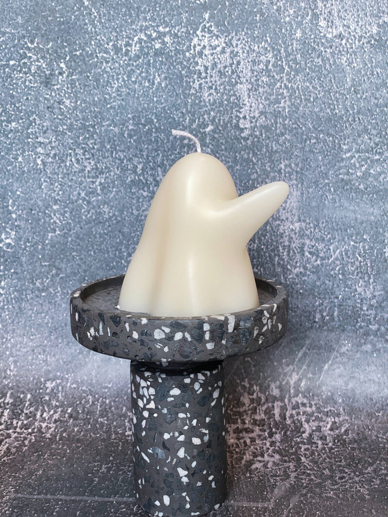 Handmade soy wax ghost candle with ivory ghost profile in speckled black holder