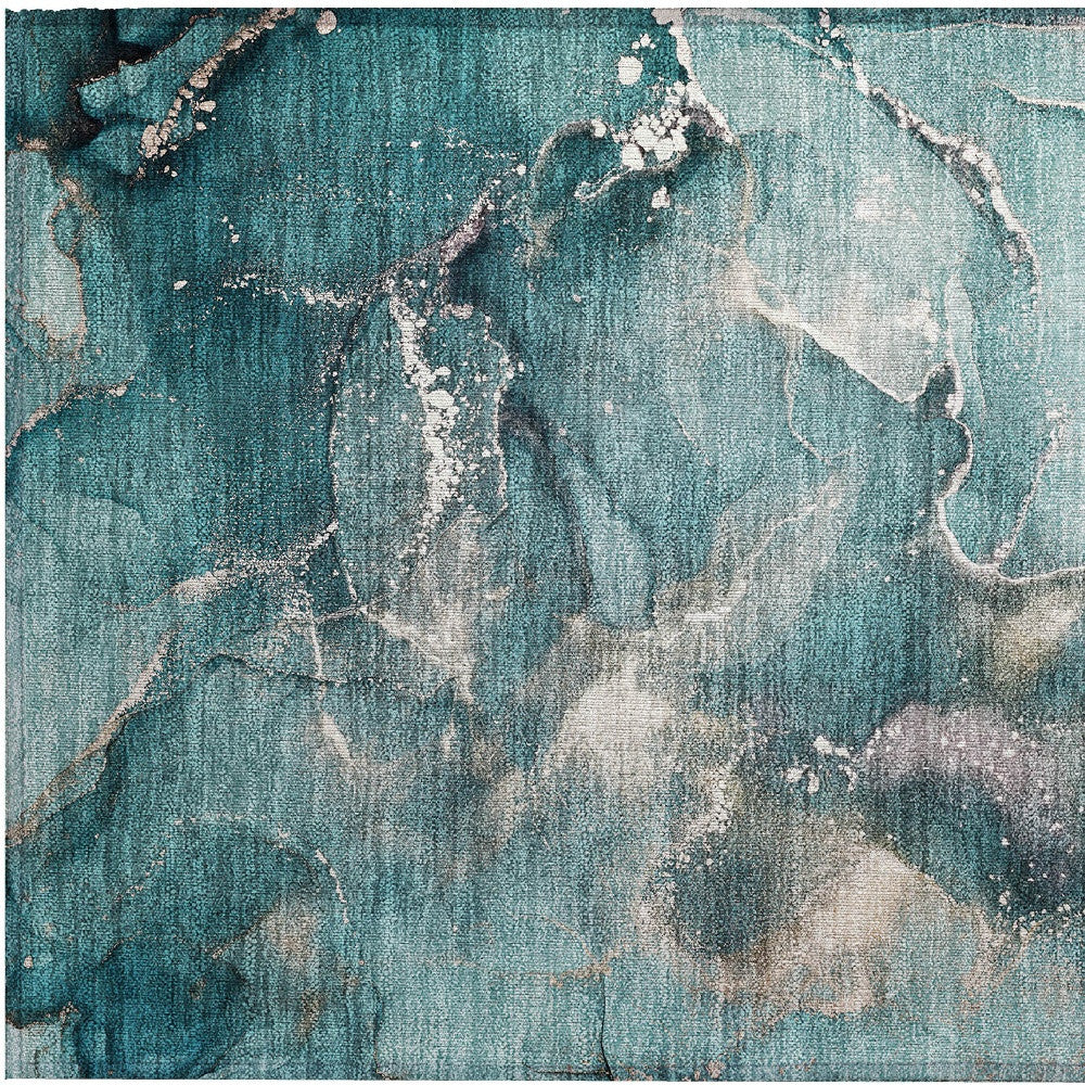 Teal abstract area rug with flowing beige cloud-like shapes and white speckling