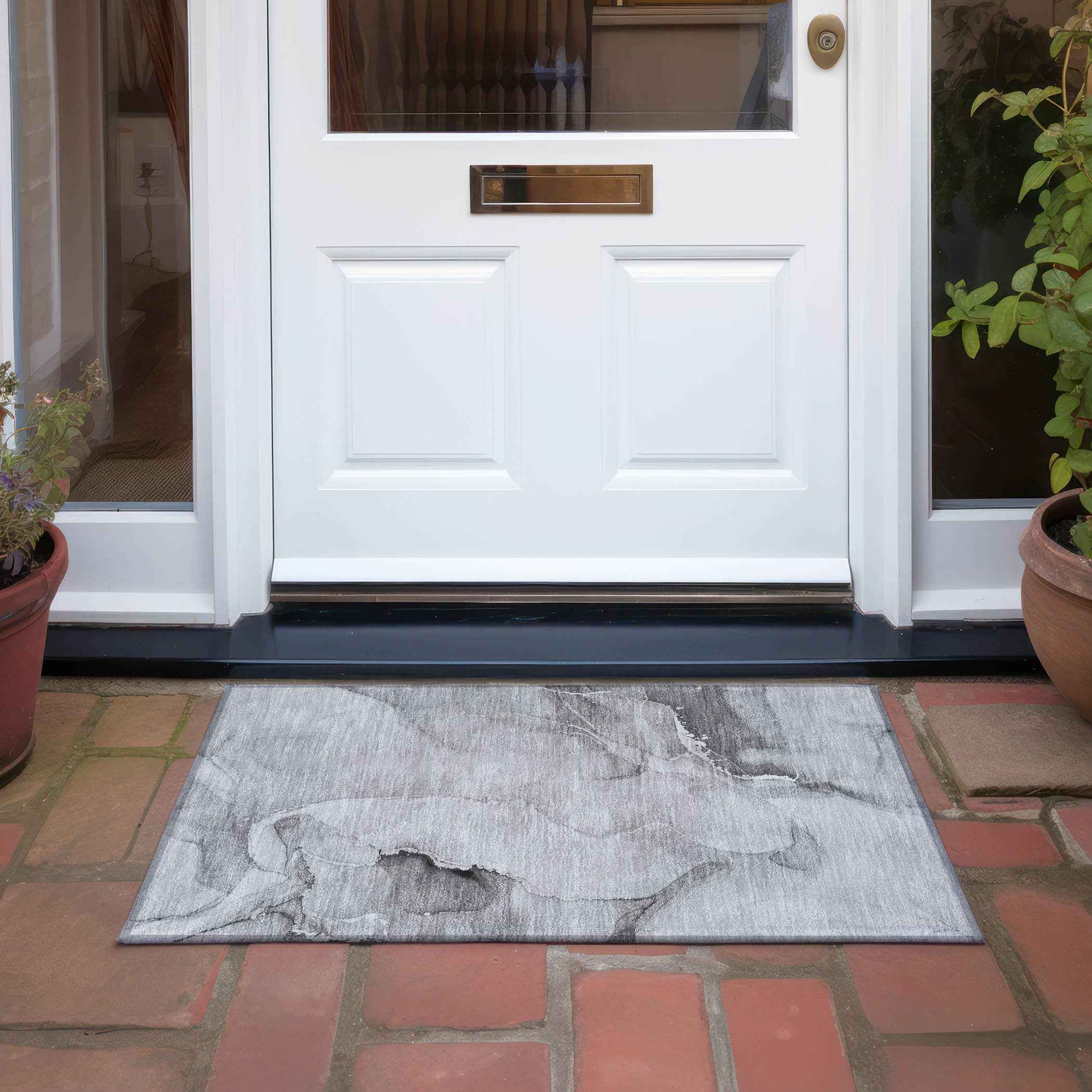 2' X 3' Gray and Ivory Abstract Washable Non Skid Indoor Outdoor Area Rug