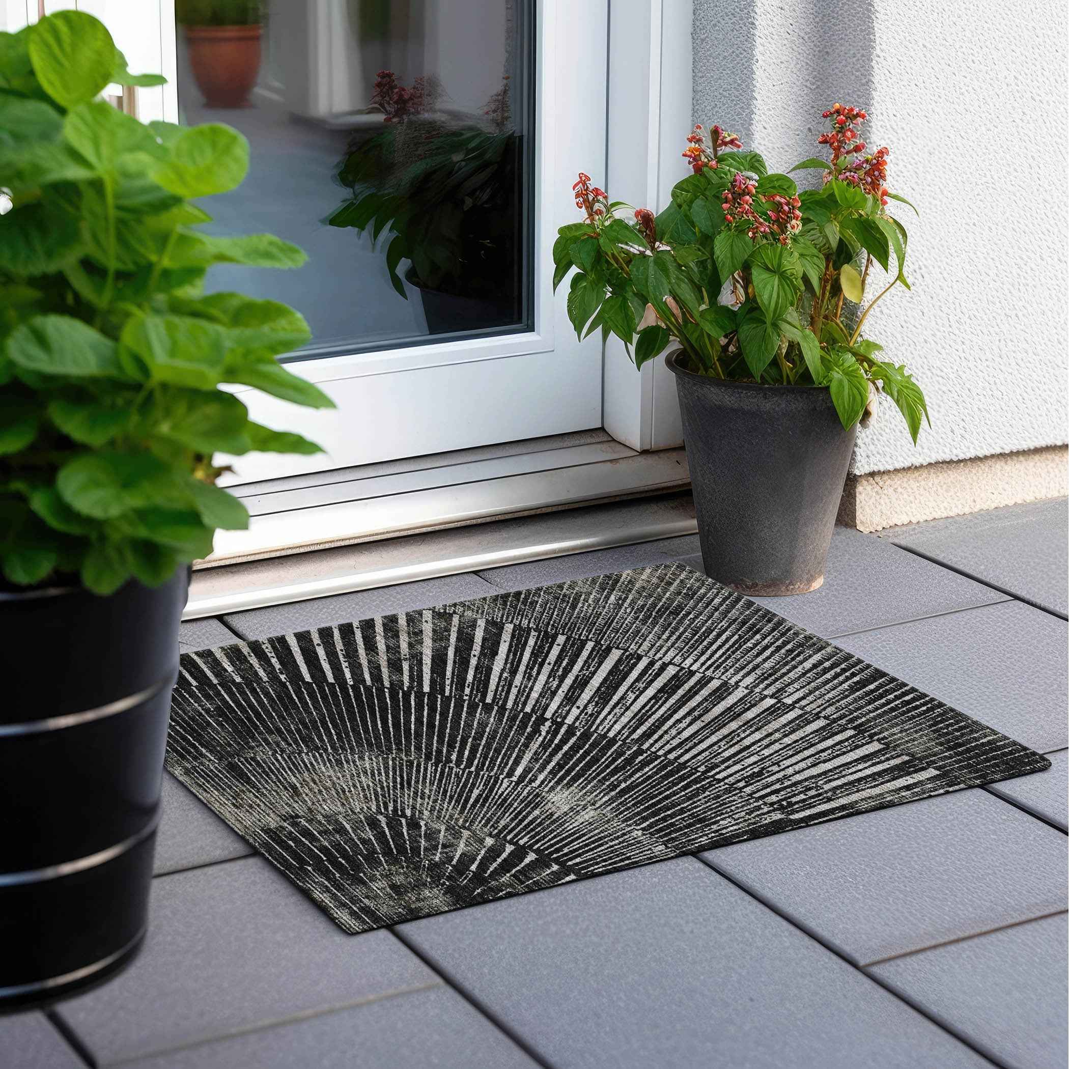 2' X 3' Black and Ivory Abstract Washable Non Skid Indoor Outdoor Area Rug