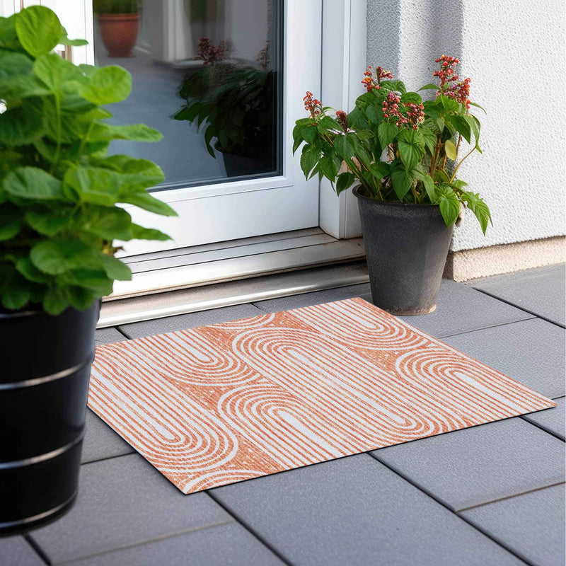 2' X 3' Orange and Ivory Abstract Washable Non Skid Indoor Outdoor Area Rug