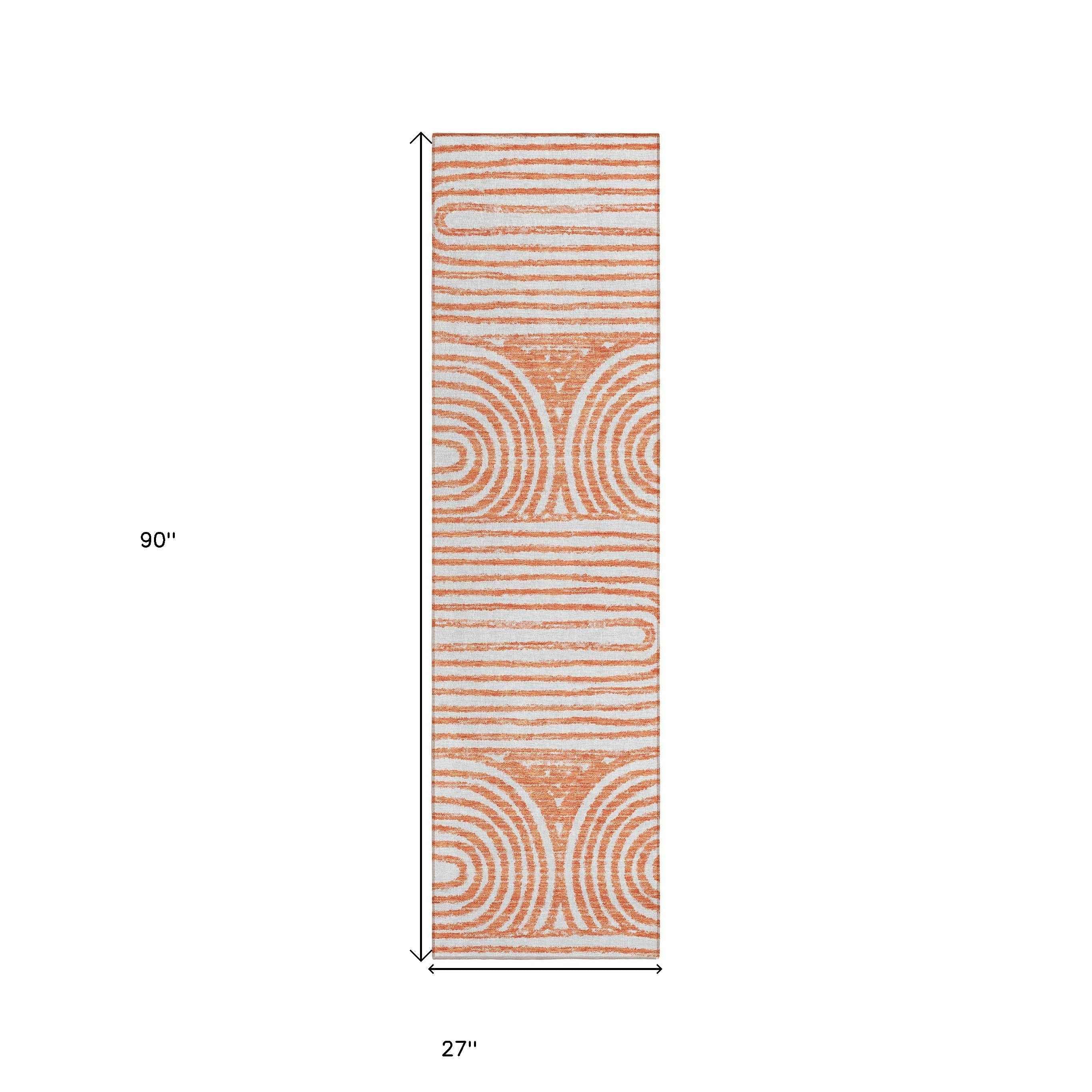 2' X 8' Orange and Ivory Abstract Washable Non Skid Indoor Outdoor Area Rug
