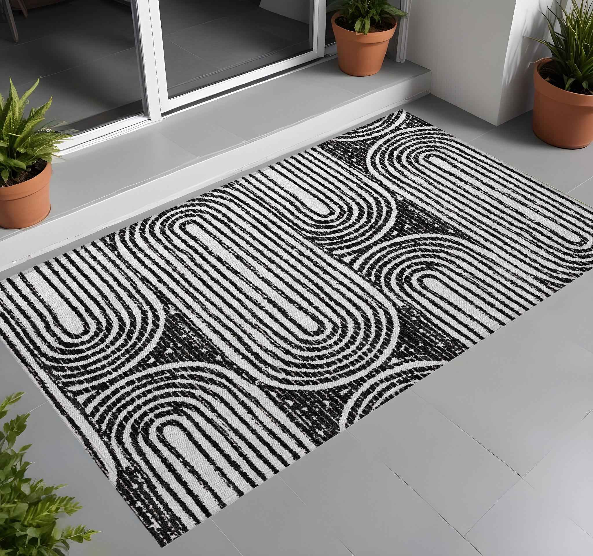 2' X 3' Black and White Abstract Washable Non Skid Indoor Outdoor Area Rug