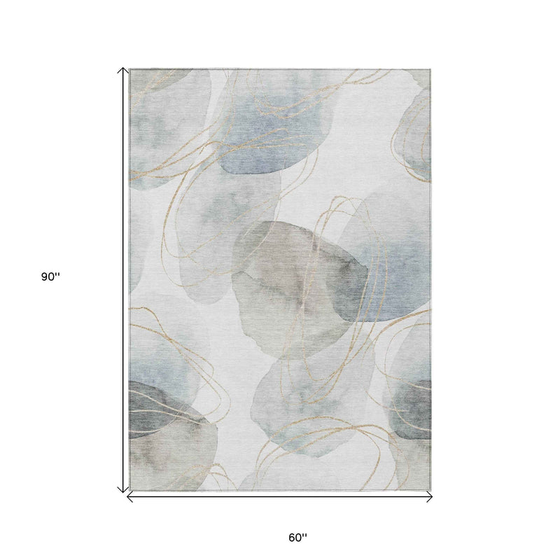 5' X 8' Ivory Blue And Gray Abstract Washable Indoor Outdoor Area Rug