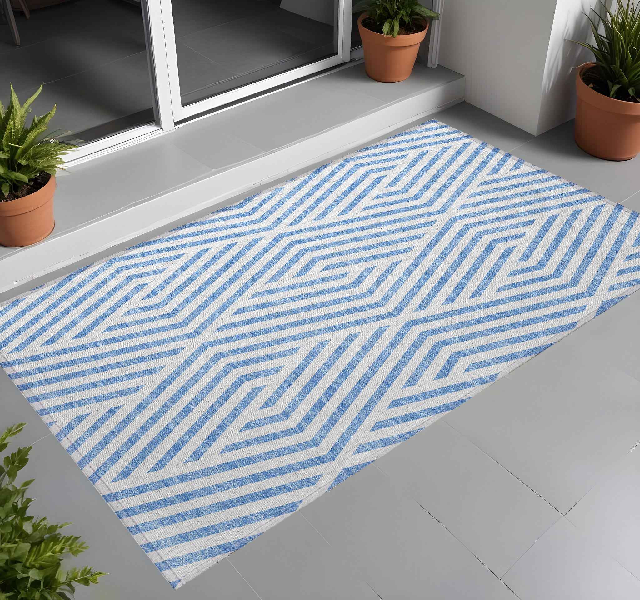 2' X 3' Blue and Ivory Geometric Washable Non Skid Indoor Outdoor Area Rug
