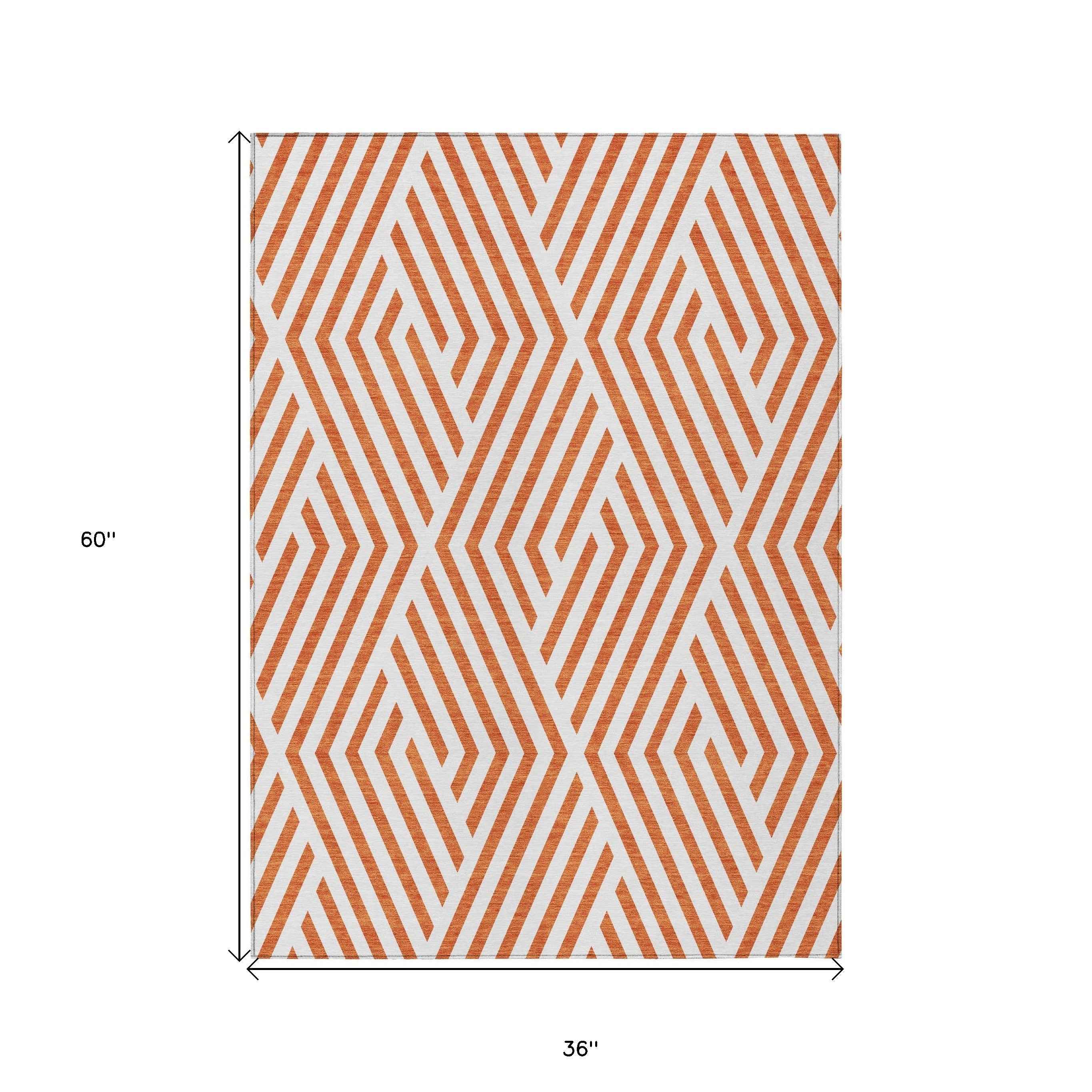3' X 5' Orange And White Geometric Washable Indoor Outdoor Area Rug