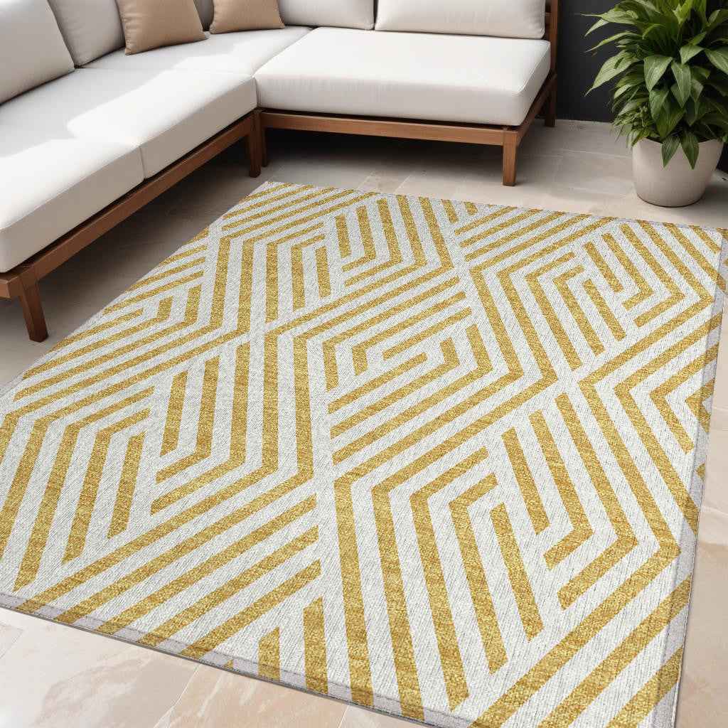 5' X 8' Gold and White Geometric Washable Non Skid Indoor Outdoor Area Rug