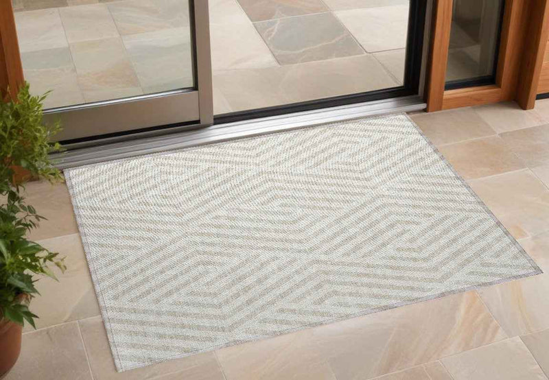 2' X 3' Beige and Ivory Geometric Washable Non Skid Indoor Outdoor Area Rug