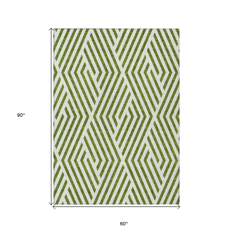 5' X 8' Lime Green and White Geometric Washable Non Skid Indoor Outdoor Area Rug