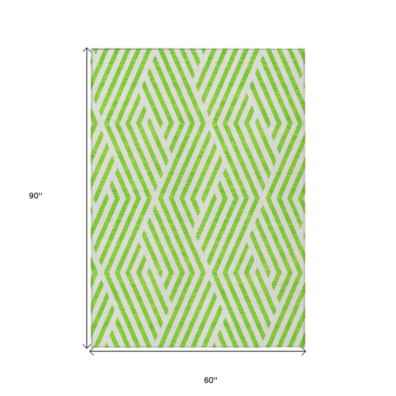 5' X 8' Lime Green and White Geometric Washable Non Skid Indoor Outdoor Area Rug