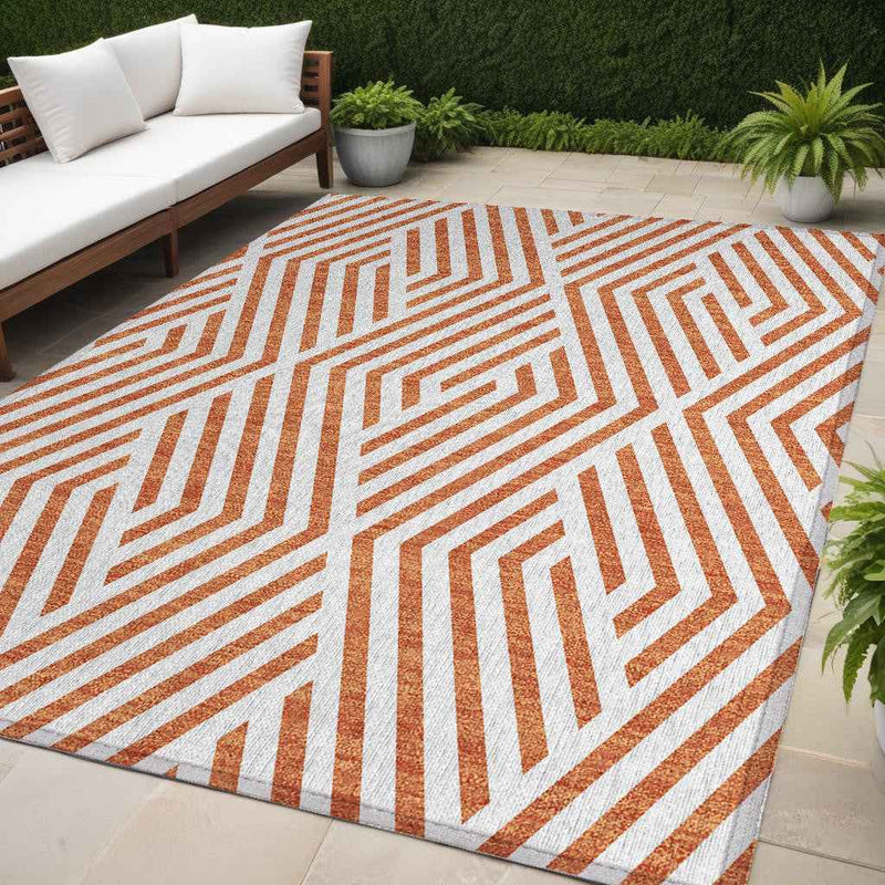 5' X 8' Orange And White Geometric Washable Indoor Outdoor Area Rug