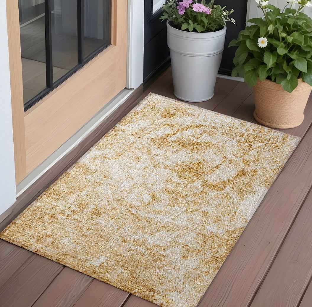 3' X 5' Cream and Gold Abstract Washable Non Skid Indoor Outdoor Area Rug