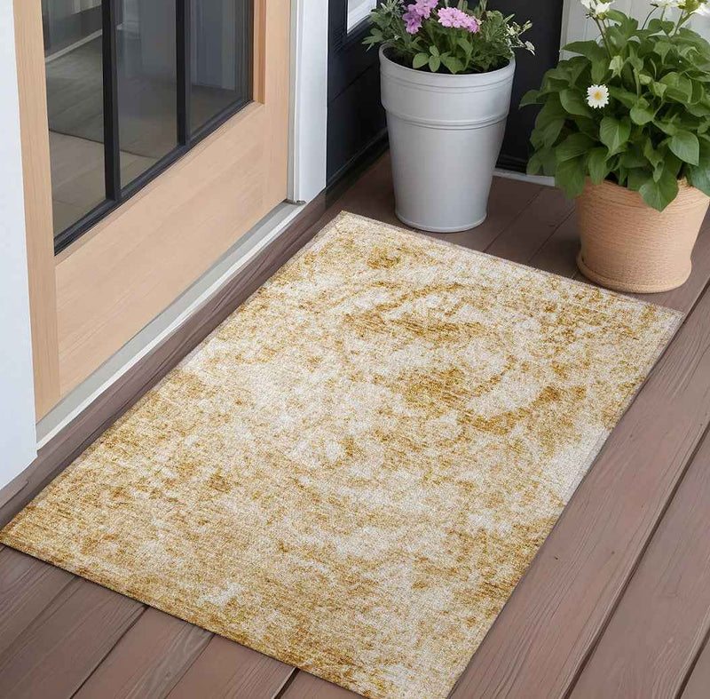 3' X 5' Cream and Gold Abstract Washable Non Skid Indoor Outdoor Area Rug