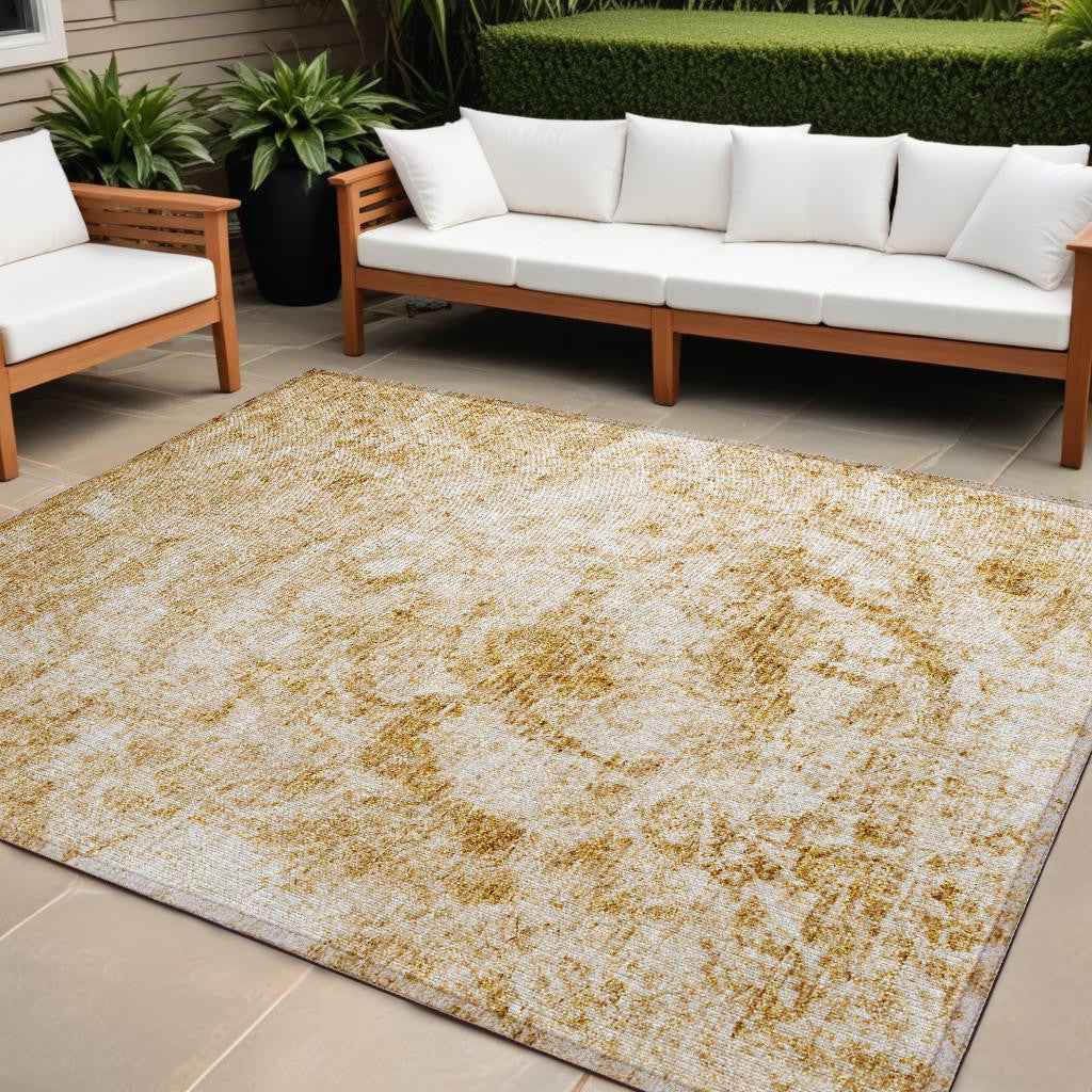 10' X 14' Cream and Gold Abstract Washable Non Skid Indoor Outdoor Area Rug