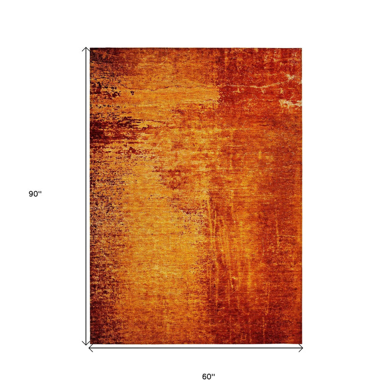 5' X 8' Orange Abstract Washable Non Skid Indoor Outdoor Area Rug