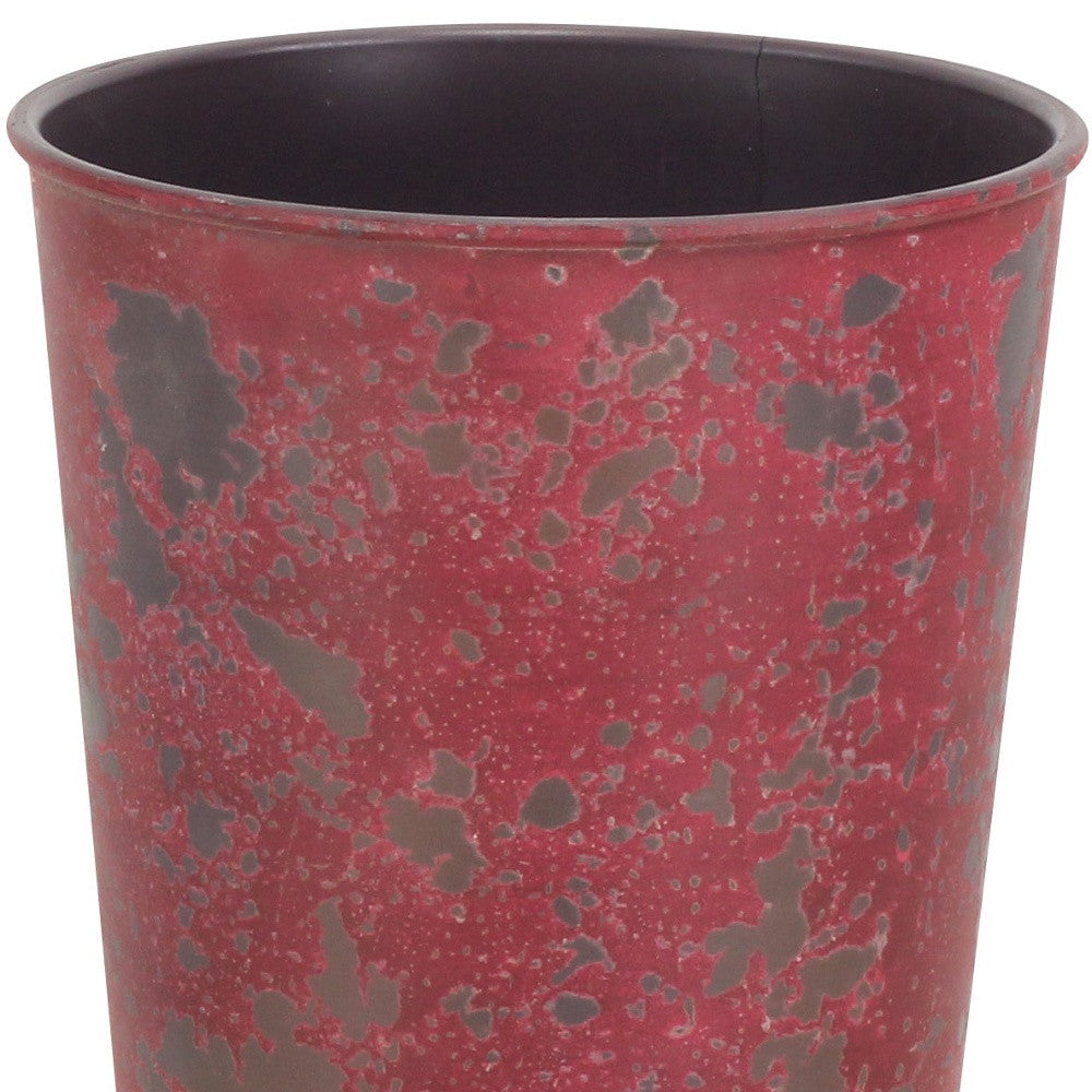 Red speckled round plastic planter with dark interior, 5 in