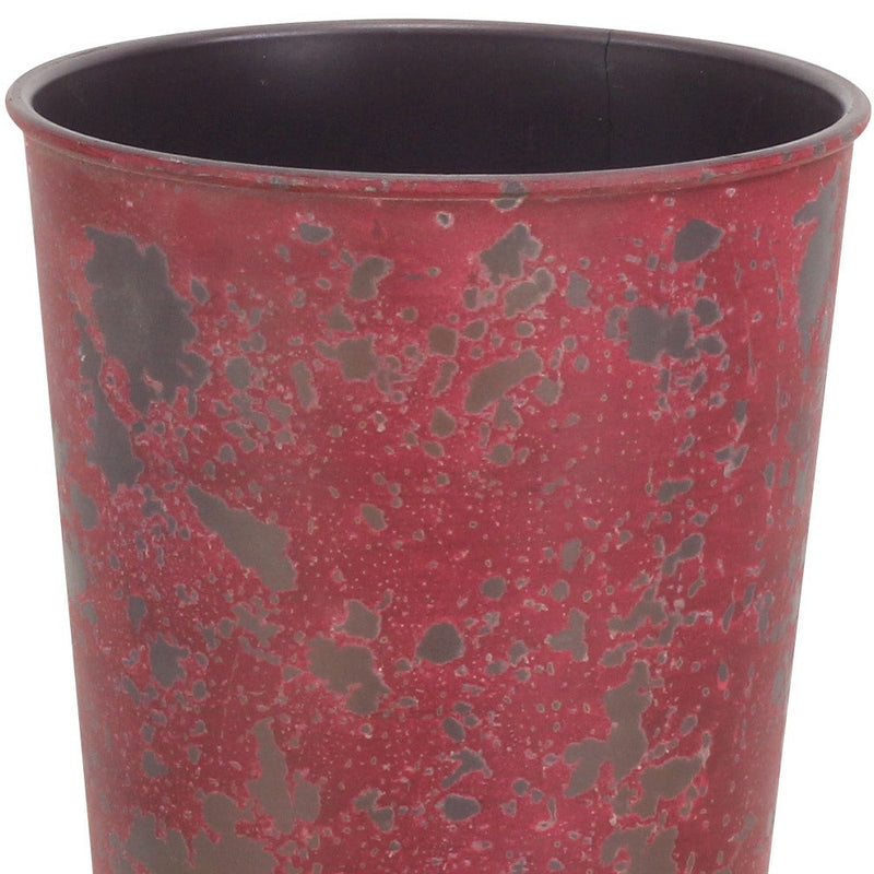Red speckled round plastic planter with dark interior, 5 in