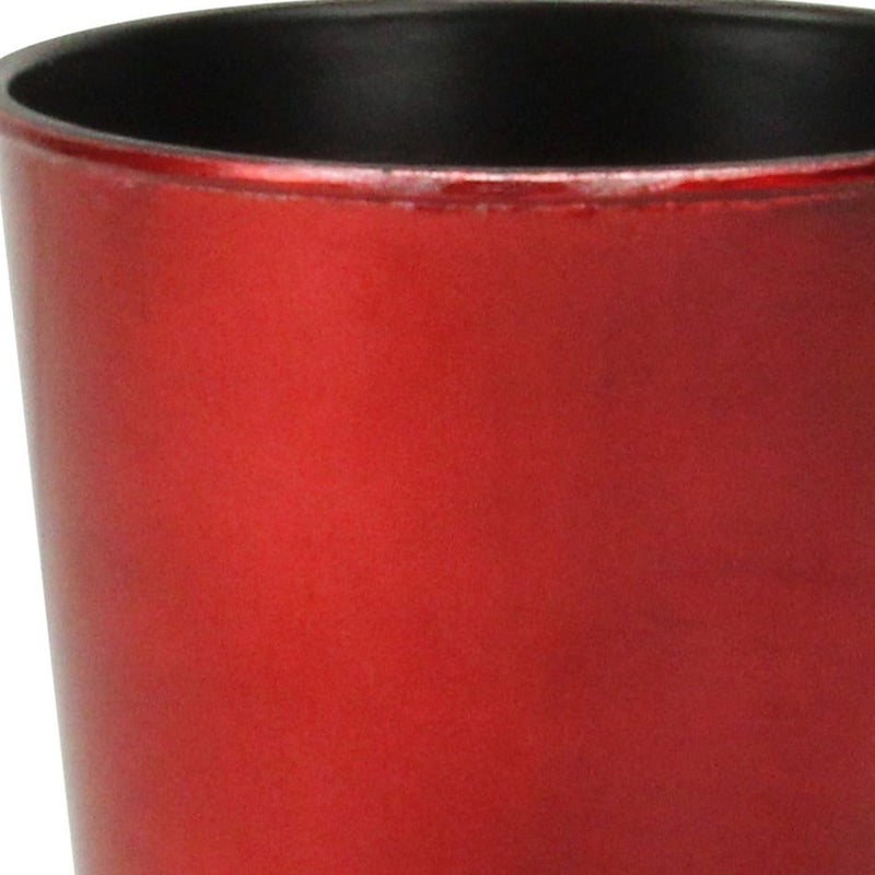 Close-up of red round plastic planter pot wall texture with black top rim