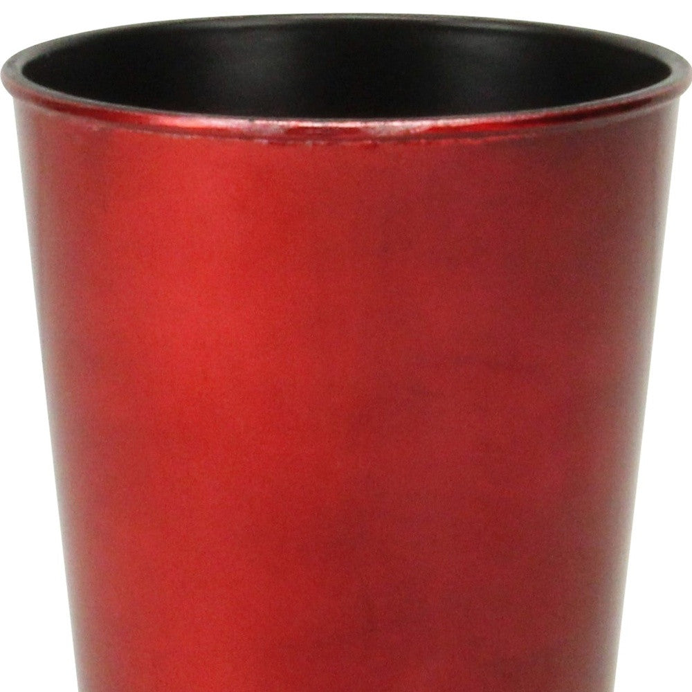 Close-up of red round plastic planter pot with black rim and interior