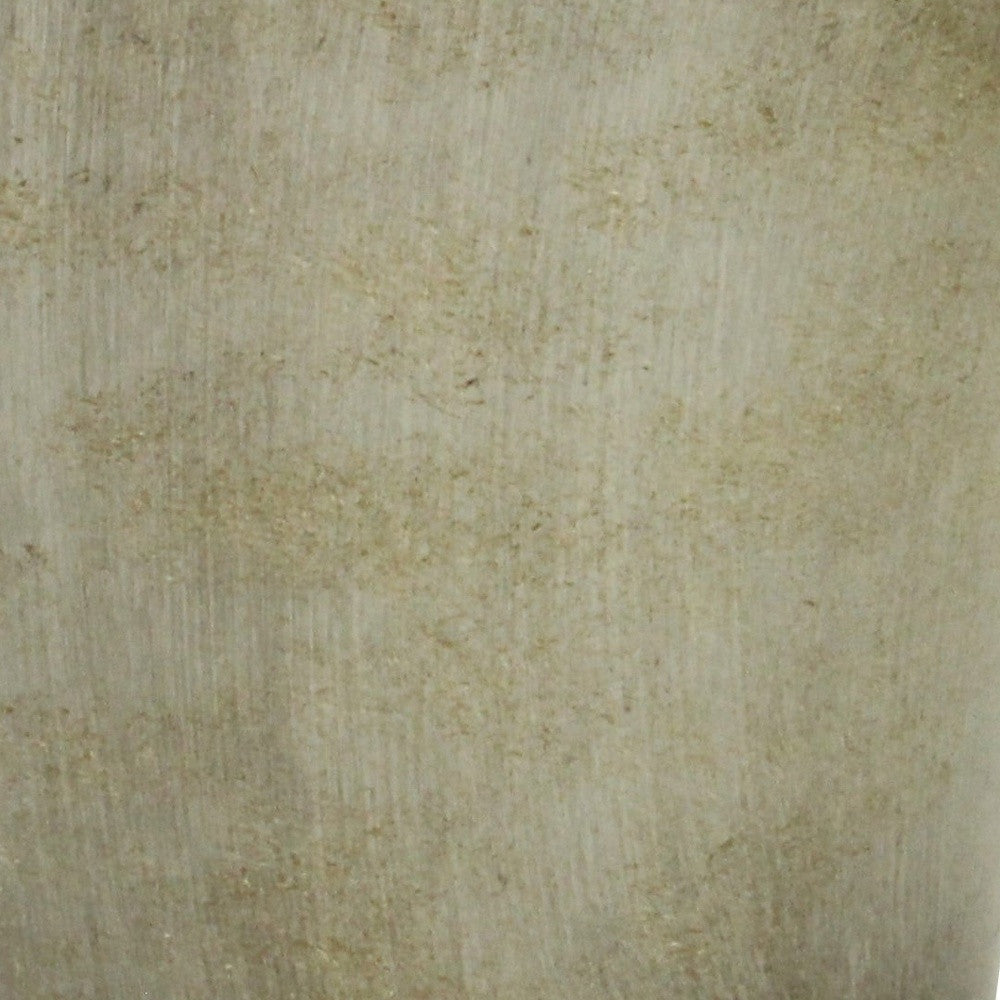 Gray planter with mottled stone-like texture on the surface close-up