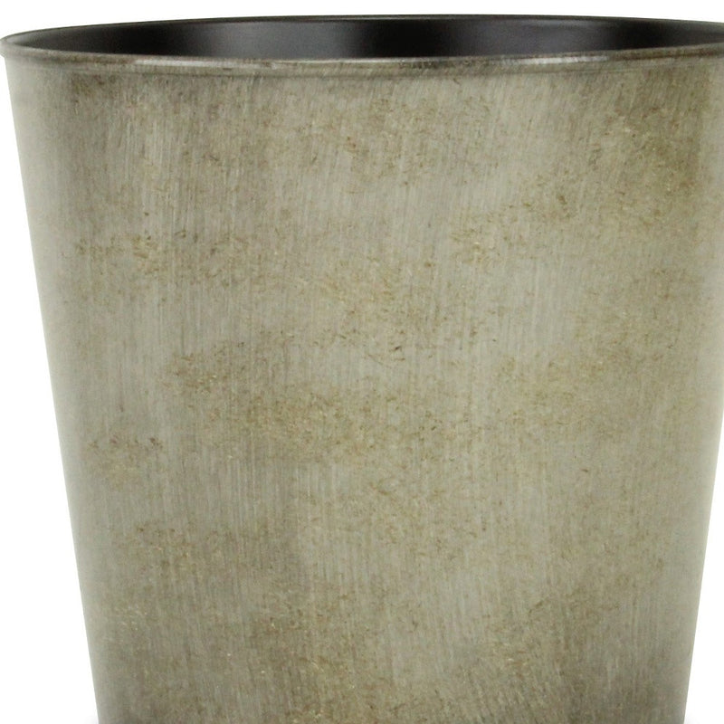 Gray round planter pot close-up showing textured exterior and dark inner rim