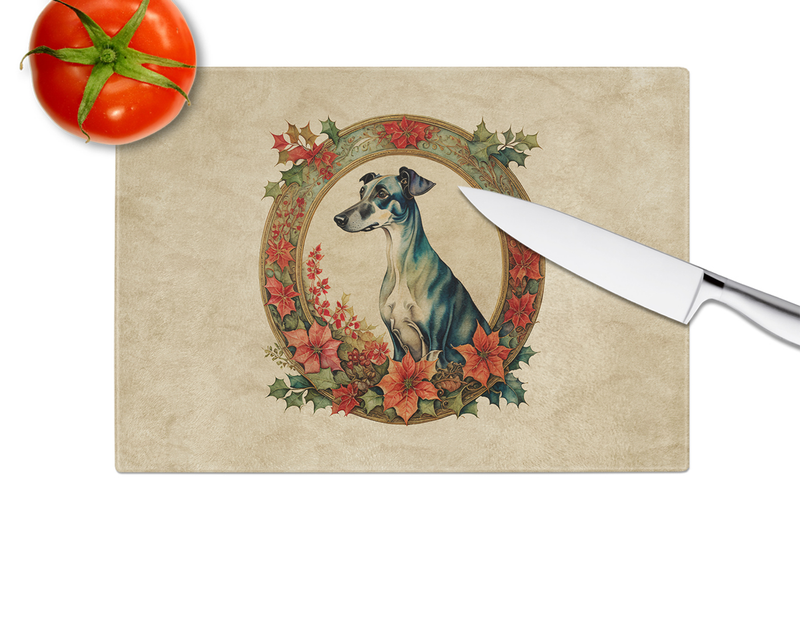 Square glass cutting board with greyhound Christmas flowers artwork, knife in view