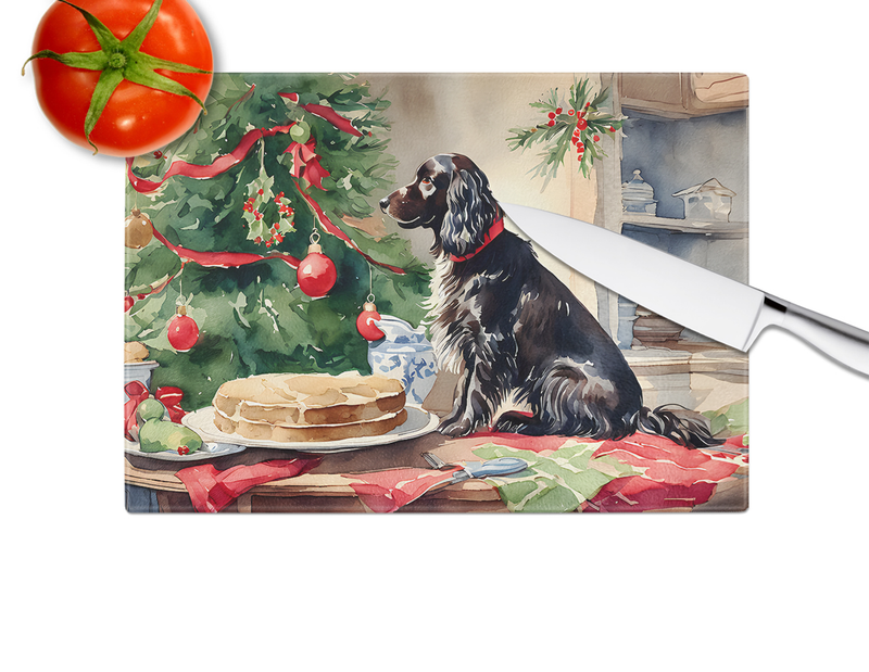 Rectangular glass cutting board with Boykin Spaniel near Christmas tree and cookies