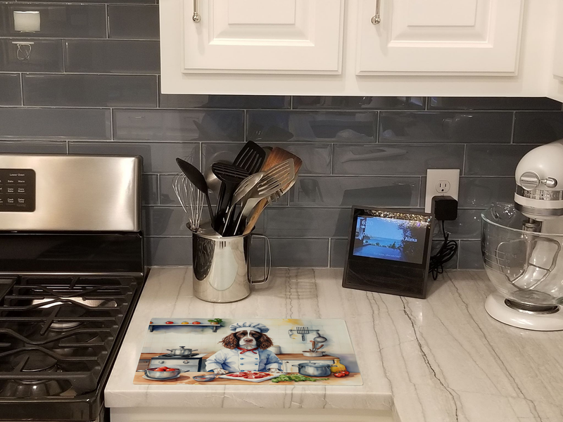 Glass cutting board with chef English Springer Spaniel print on kitchen counter