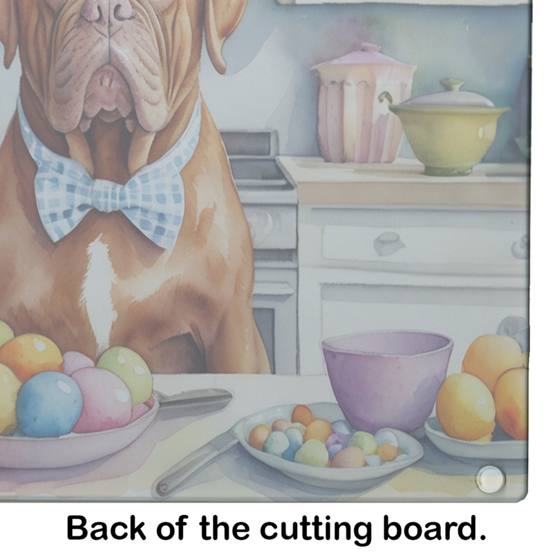 Glass cutting board close-up of Dogue de Bordeaux with bowtie and Easter egg bowl