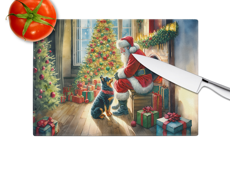 Glass cutting board showing Santa, blue cat, and gifts by Christmas tree