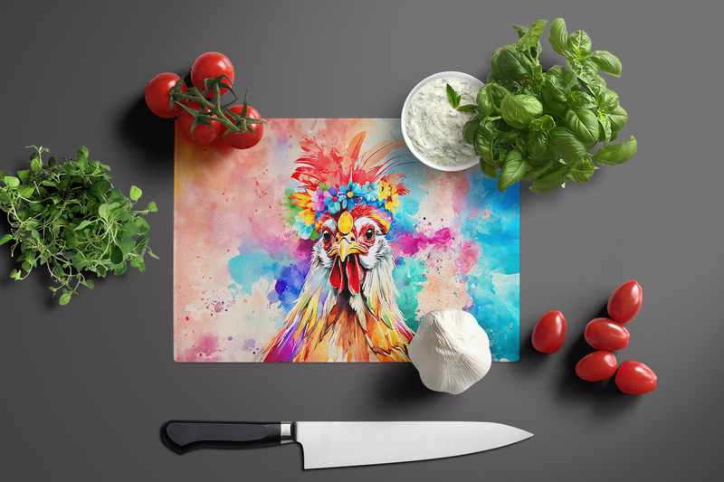 Colorful rooster glass cutting board with chef knife resting beside it