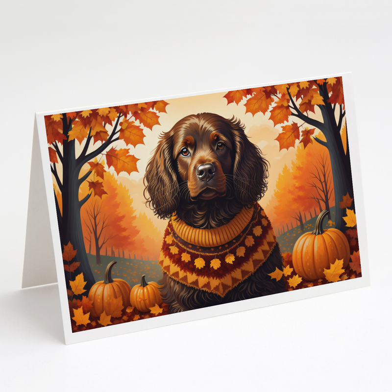 Folded greeting card featuring brown spaniel portrait with orange autumn trees and pumpkins