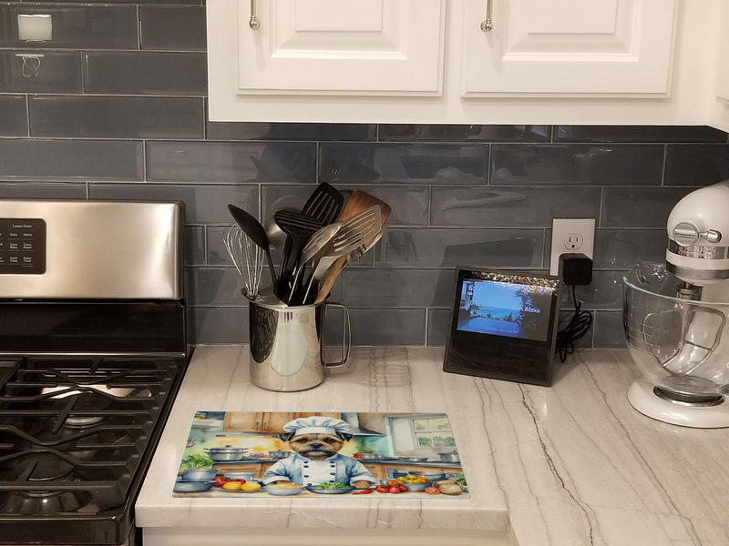 Glass cutting board with border terrier chef scene on the countertop
