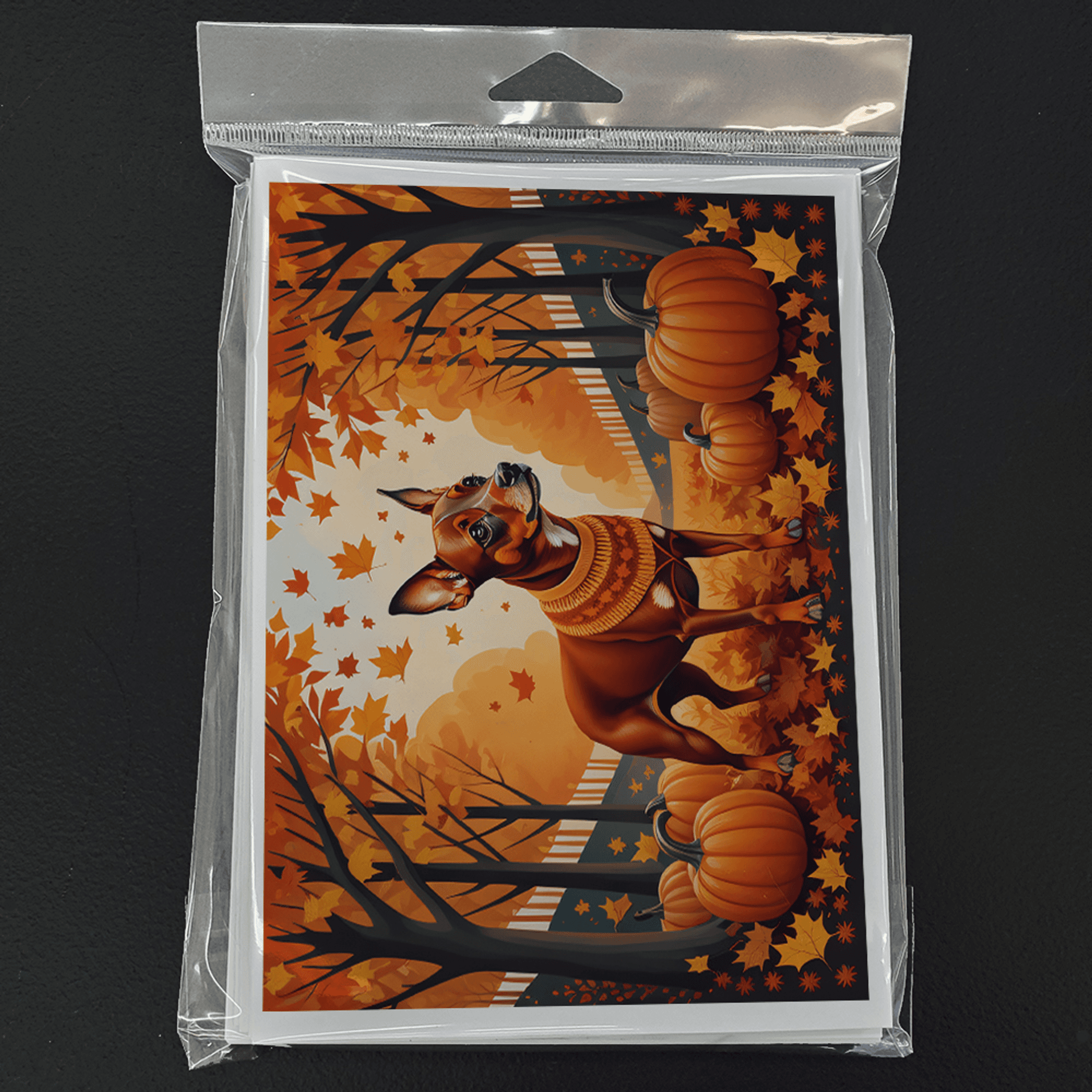 Packaged fall greeting card with miniature pinscher, pumpkins, and orange autumn trees