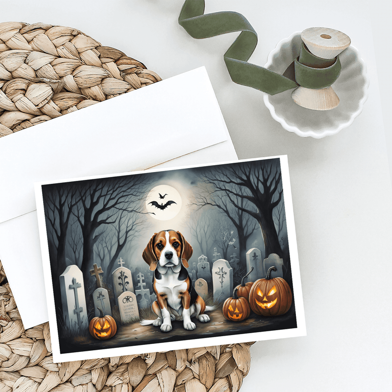 Halloween greeting card with a beagle, tombstones, bats, and carved pumpkins