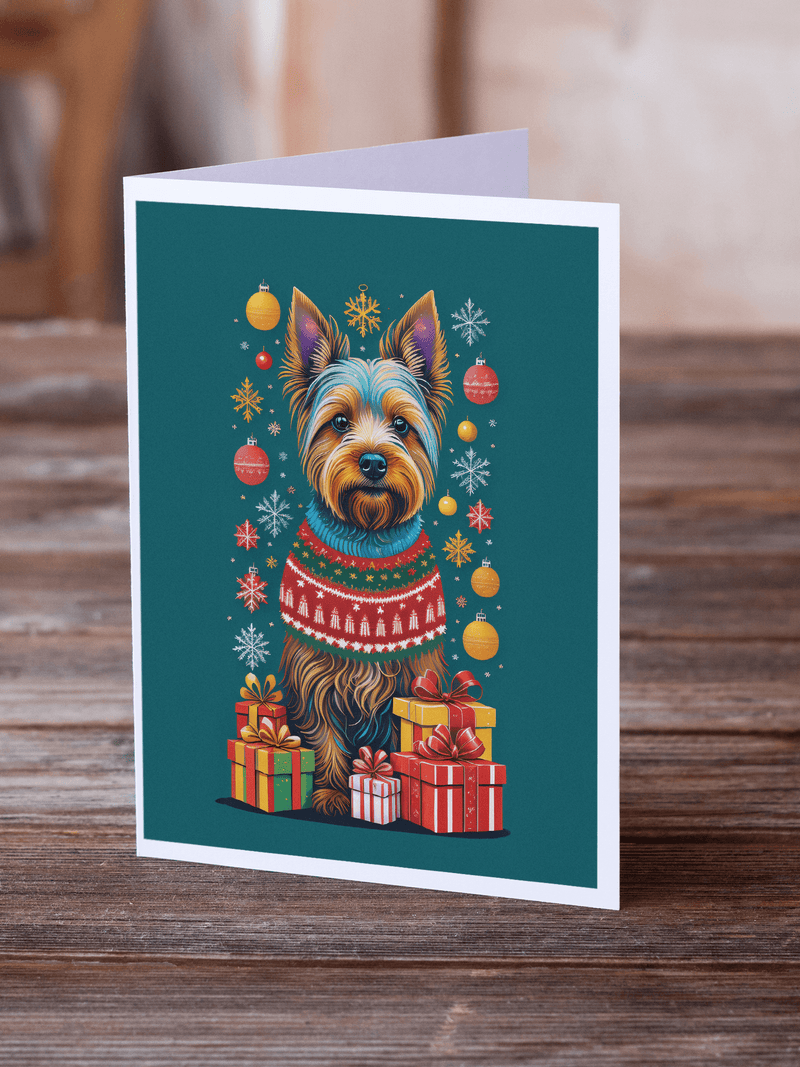 Holiday greeting card showing illustrated terrier in sweater beside wrapped presents