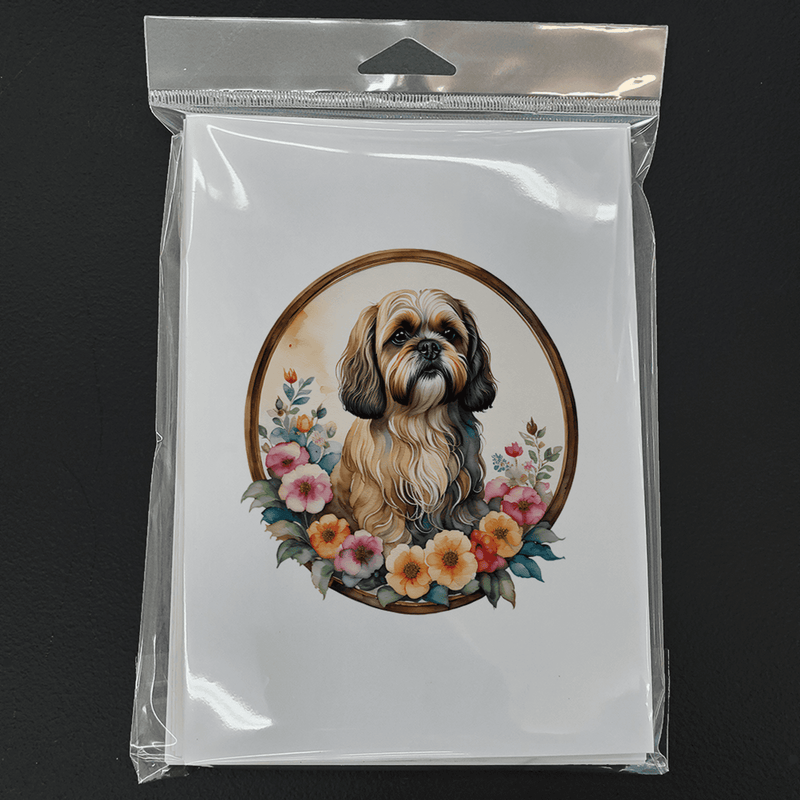 Pack of 8 Lhasa Apso greeting cards in clear plastic, card fronts show floral wreath portrait.