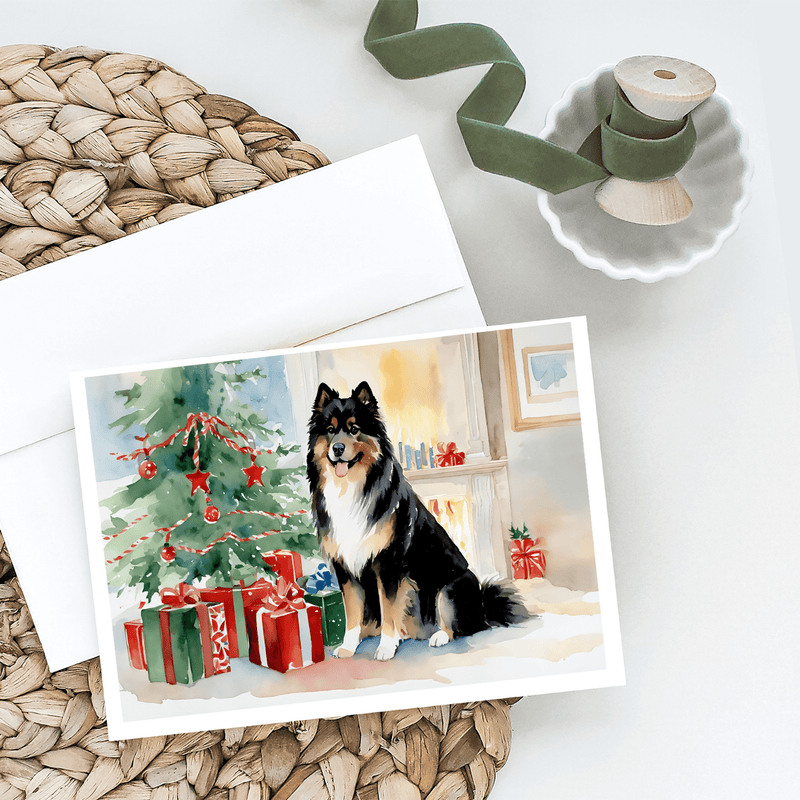 Christmas greeting card set featuring black, tan, and white dog by decorated tree and gifts