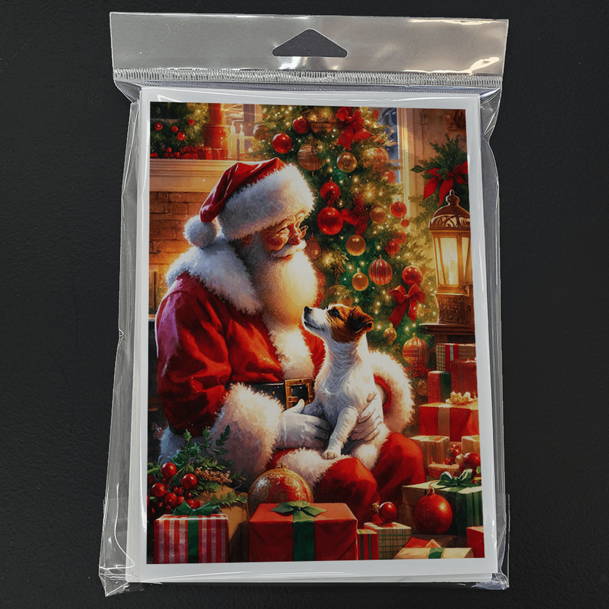 Pack of Christmas greeting cards in plastic sleeve, Santa with Jack Russell near a tree