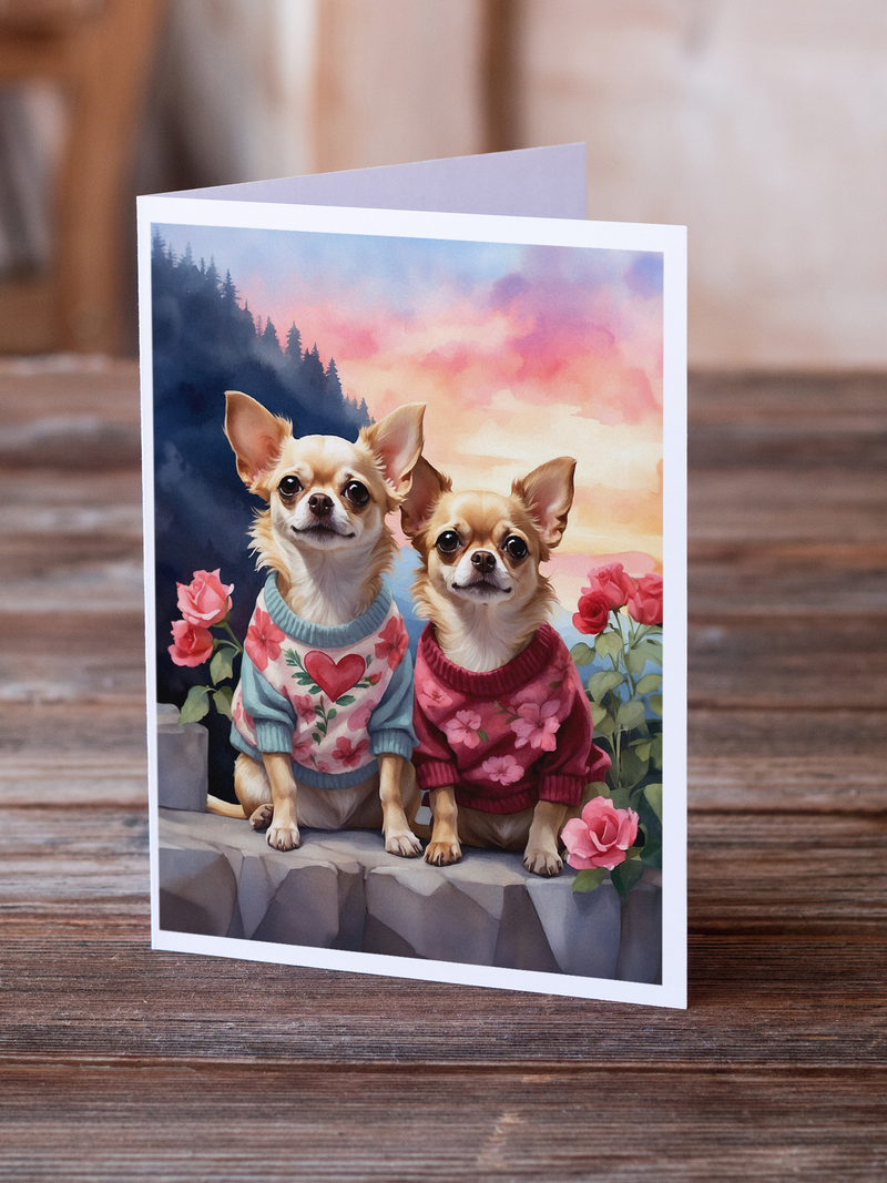Greeting card with two chihuahuas wearing sweaters, heart design and flowers