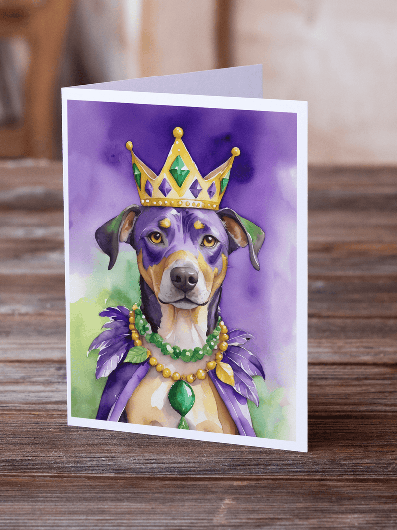 Greeting card with crowned dog illustration and green bead necklace with purple feather accents