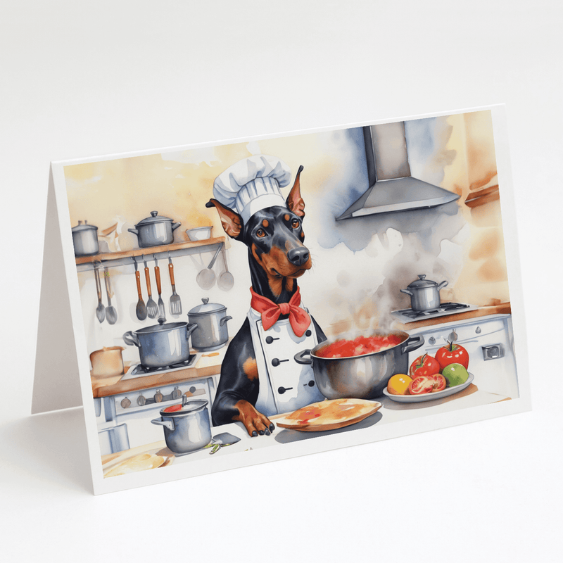 Single greeting card featuring a Doberman chef with red bow tie cooking in kitchen