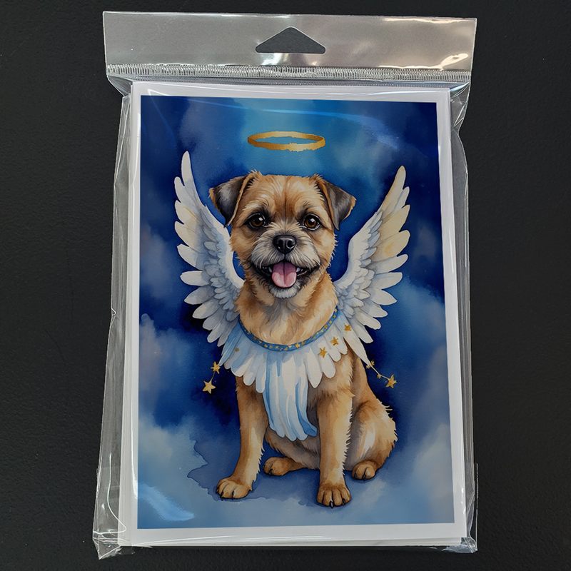 Packaged border terrier angel greeting card with white wings, blue background, gold halo