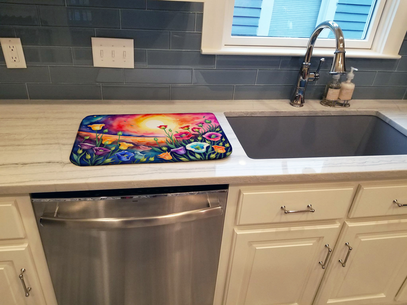 Colorful floral dish drying mat on kitchen counter near a sink basin
