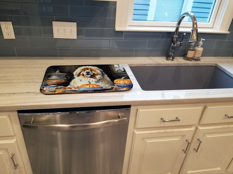Dog-themed dish drying mat with Tibetan Mastiff illustration in a kitchen sink