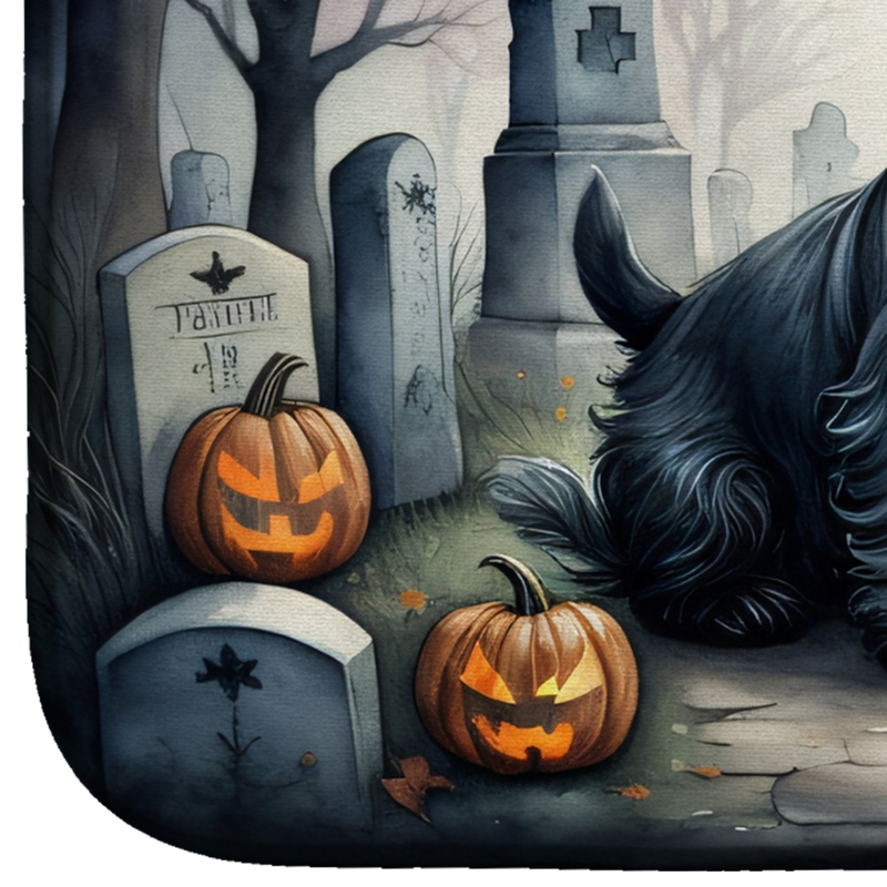 Halloween dish drying mat close-up of black terrier with carved pumpkins and tombstones