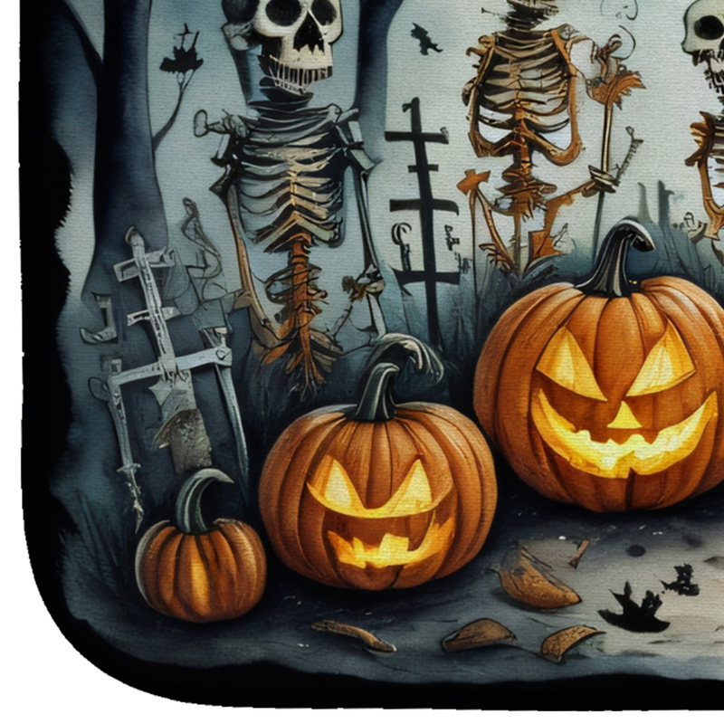 Rectangular Halloween dish drying mat with skeletons, jack-o'-lanterns, and bats print