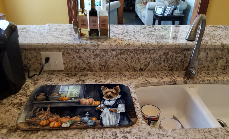 Terrier-themed fall dish drying mat placed in sink for drying dishes